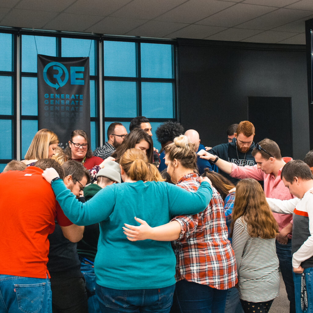 Group of Connect family praying together
